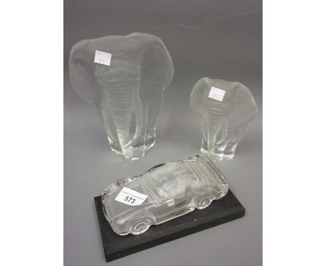 Large Swedish glass figure of an elephant, another smaller and a German model of a racing car on a wooden standCar - Makers m