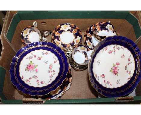 Royal Albert twelve place setting tea service decorated in Imari colours, together a floral decorated blue and gilt dessert s