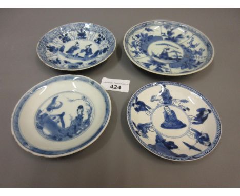 Group of four various small Chinese blue and white saucers, three signed to the baseNumerous minor rim chips to the 3 smaller