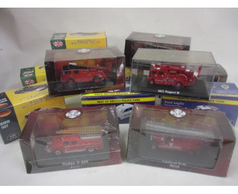 Twelve diecast metal model vehicles in original boxes including fire engines, police vehicles etc. 
