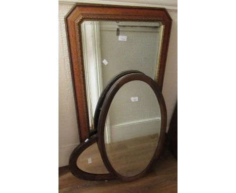 Mahogany oval inlaid wall mirror with bevelled plate, another similar later mirror and a modern rectangular wall mirror 