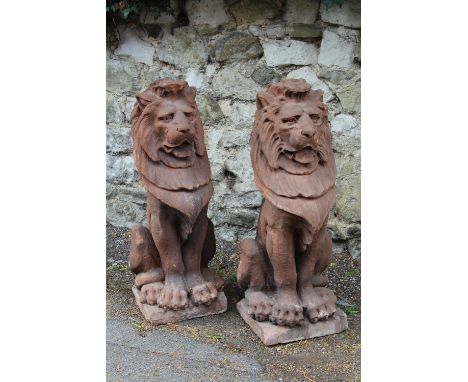 Pair of large late 19th Century English carved red sandstone figures of seated lions, possibly after a model by Alfred Steven