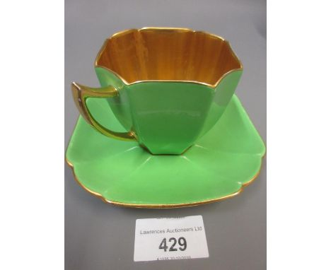 Shelley green and gilt decorated tea service of Art Deco design11 small plates 7 cups 8 saucers small chip to one cup losses 