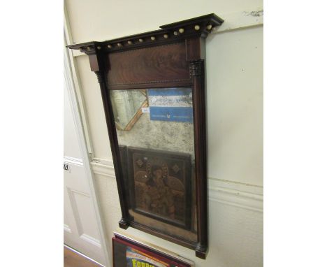 Regency mahogany rectangular pier mirror, the moulded ball pattern cornice above a plain frieze, the rectangular plate flanke