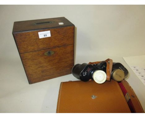 Victorian oak two bottle decanter box and a pair of Swallow binoculars 