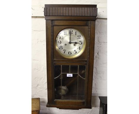 Early 20th Century rectangular oak cased wall clock with silvered dial Arabic numerals and two train movement 
