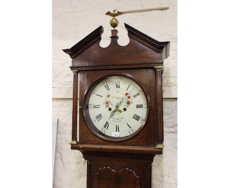 George III oak mahogany crossbanded longcase clock, the square hood with broken arch pediment above shaped door and conformin