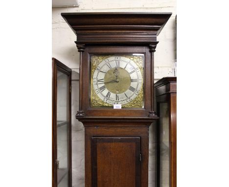 18th Century oak longcase clock, the square hood above a panel door and conforming plinth base, the square brass dial with si