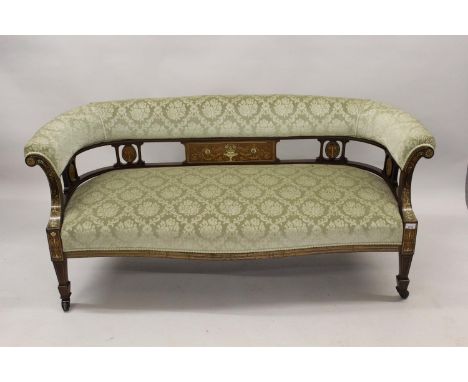 Edwardian rosewood and marquetry inlaid drawing room sofa, the rolled back and overstuffed seat covered in a figured floral m