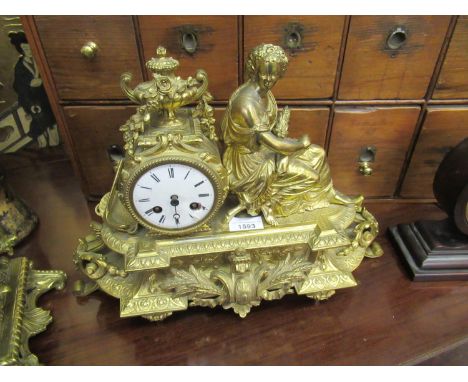 French 19th Century gilt patinated spelter mantel clock with figural surmount, the circular enamelled dial (at fault) with a 