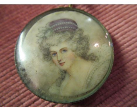 19th Century miniature circular head and shoulder portrait on ivorine of a 19th Century lady wearing a hat in an earlier 18th