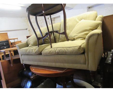 Modern upholstered two seater sofa on turned front supports 
