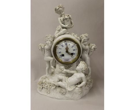 19th Century Meissen blanc de chine mantel clock mounted with figures of cherubs with grapes and a wine goblet, the circular 