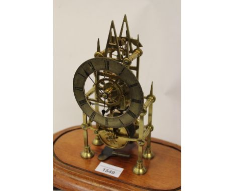 Small 19th Century brass skeleton clock, the silvered dial with Roman numerals and single train fusee movement 