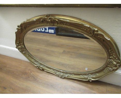 Oval gilt framed wall mirror with bevelled plate 