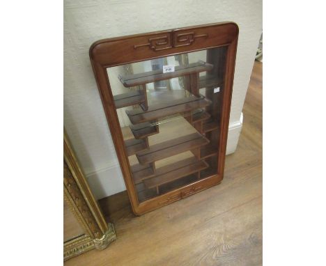 Mid 20th Century oriental hardwood wall cabinet with a single glazed door enclosing various shelves together with a similar r