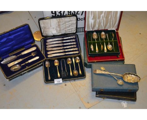 Cased part set of silver butter knife, pickle fork and plated jam spoon, together with a cased part set of silver teaspoons w