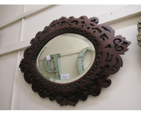 19th Century oval walnut blind fretwork carved mirror with original oval bevelled plate 