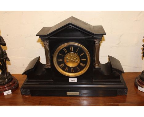 Large French black slate mantel clock, the circular ceramic dial with Roman numerals with a two train visible escapement stri