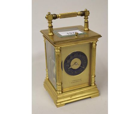 Late 19th Century gilt brass cased carriage clock, the Royal blue enamel dial with Arabic numerals on a gilt ground, signed P