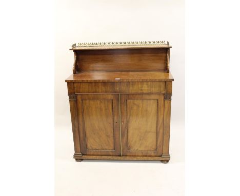 Early Victorian mahogany chiffonier, the shelf back with a brass gallery above a single drawer and two panel doors, raised on