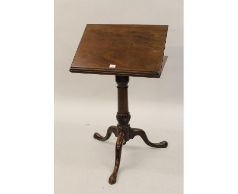 18th Century mahogany reading table, the hinged adjustable top raised on turned column and tripod support 