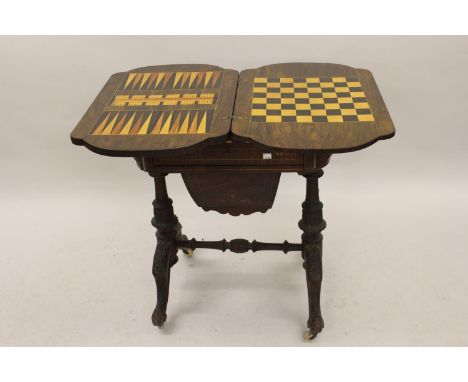 Victorian walnut and marquetry inlaid games / work table, the fold-over swivel top inlaid for chess and backgammon above a fi