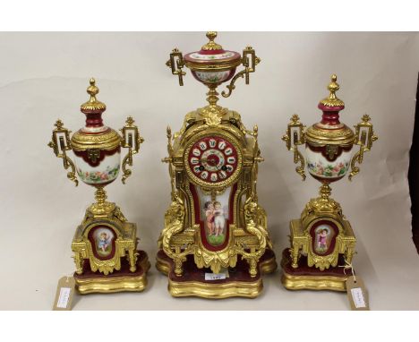 19th Century French ormolu porcelain mounted three piece clock garniture, the porcelain panels painted with children with a t