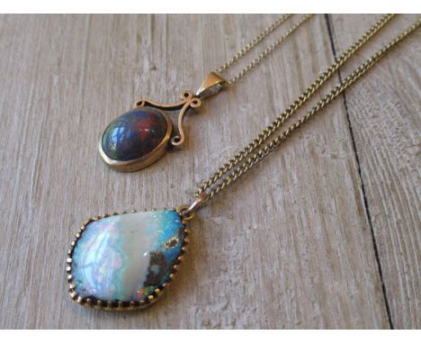 9ct Gold mounted oval opal pendant on chain together with another opal pendant on chain 