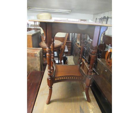 Edwardian walnut octagonal two tier occasional table on ring turned tapering splay supports with galleried undertier (at faul