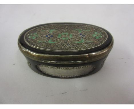 19th Century oval filigree and enamel mounted horn snuff box with gilt and white metal mounts (at fault), 3ins wide 