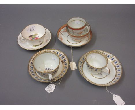 Late 18th Century English porcelain trio decorated in gilt and sepia, two similar Worcester cups and saucers and a Davenport 
