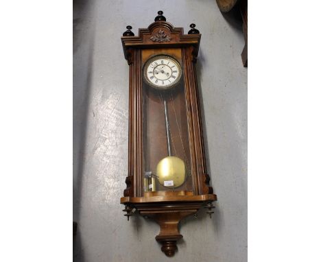 19th Century Vienna type walnut wall clock, the enamelled dial with Roman numerals and subsidiary seconds with two train weig