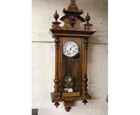 19th Century walnut cased Vienna type wall clock with an enamel dial and two train movement, 39ins high 