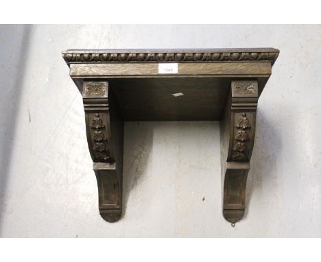 Late Victorian oak clock bracket 