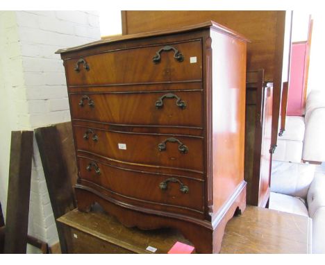 Reproduction mahogany four drawer serpentine chest and a reproduction mahogany two drawer drop-leaf sofa table 