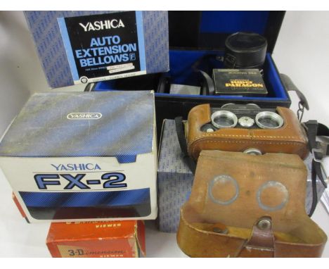 Leather cased Viewmaster 3D camera together with a quantity of other camera related items and SLR lenses etc. 