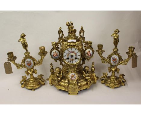 19th Century French ormolu porcelain mounted three piece clock garniture, the porcelain panels painted with cherubs and music