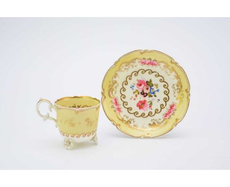 H&amp;R Daniel - A coffee cup and saucer, circa 1827of 'C' scroll border shape, the cup raised on three 'daisy-wheel' feet, t