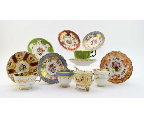 H&R Daniel - A small group of tea and coffee wares  comprising a 'C' scroll teacup, raised on daisy wheel feet, and matching 