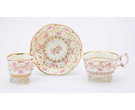 H&R Daniel - A trio of a teacup, a coffee cup and a saucer circa 1827 pattern 4413, of 'C' scroll shape, decorated with pink 