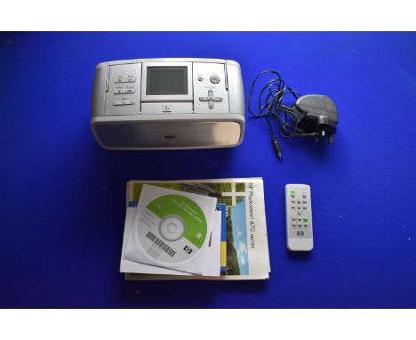 HP Photosmart 475 Printer, with manual, discs and paper, very good condition. Not tested