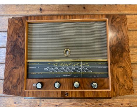 A Vintage Pye Radio Receiver. A vintage Pye FenMan II tabletop LW/MW/FM radio receiver in an attractive walnut veneered casin