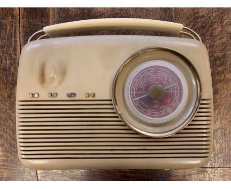 Vintage Bush Portable Radio.  A vintage Bush VTR103 portable transistor radio from the early 1960s. Two-tone cream and red ba