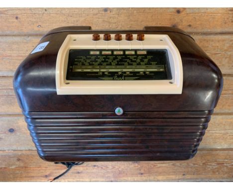 A vintage 1950 Bush DAC-10 radio in two-tone bakelite with glass tuning display and push-button band control. Classic retro 1