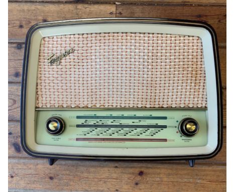 VINTAGE BAKELITE RADIO. A vintage Ferguson Model 382U 'Firefly' tabletop radio receiver with medium, long and VHF wavebands. 