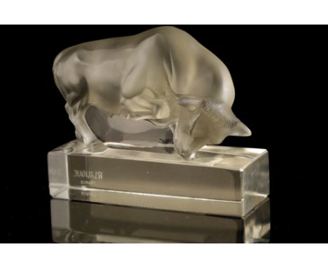 RENE LALIQUE: A "TAUREAU" CLEAR AND FROSTED GLASS PAPERWEIGHT, c.1931, no.1194, modelled in the form of a Taurus, on a clear 