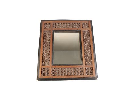 ANGLO-MOORISH WALL MIRROR, probably by Liberty & Co, rectangular form, the mirror plate within a bobbin turned and ebonised f