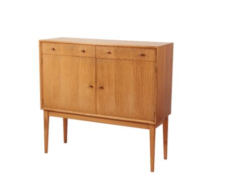 •GORDON RUSSELL: A "HELIX" TYPE SIDEBOARD, rectangular top with two fitted drawers below, two cupboard doors decorated with a