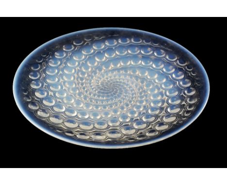 RENE LALIQUE: A "VOLUTES" OPALESCENT GLASS DISH, c. 1934, circular form, moulded in relief with a spiral spot design, etched 